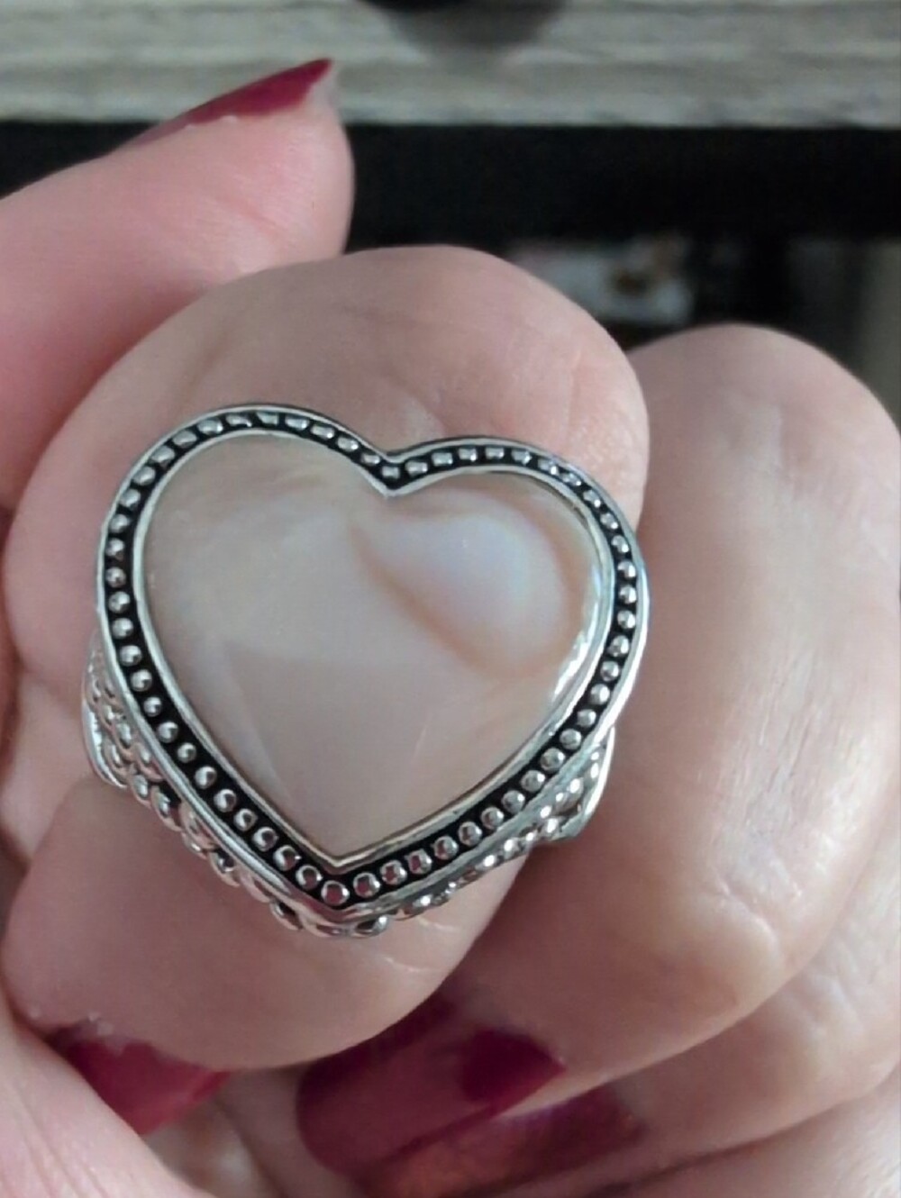heart-shaped mother-of-pearl cabochon with a dotted beaded border
